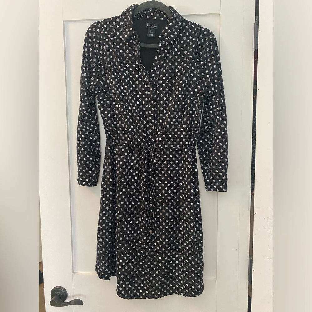 Nicole Miller, Black with white design detailed dress. Long sleeved. Size 4